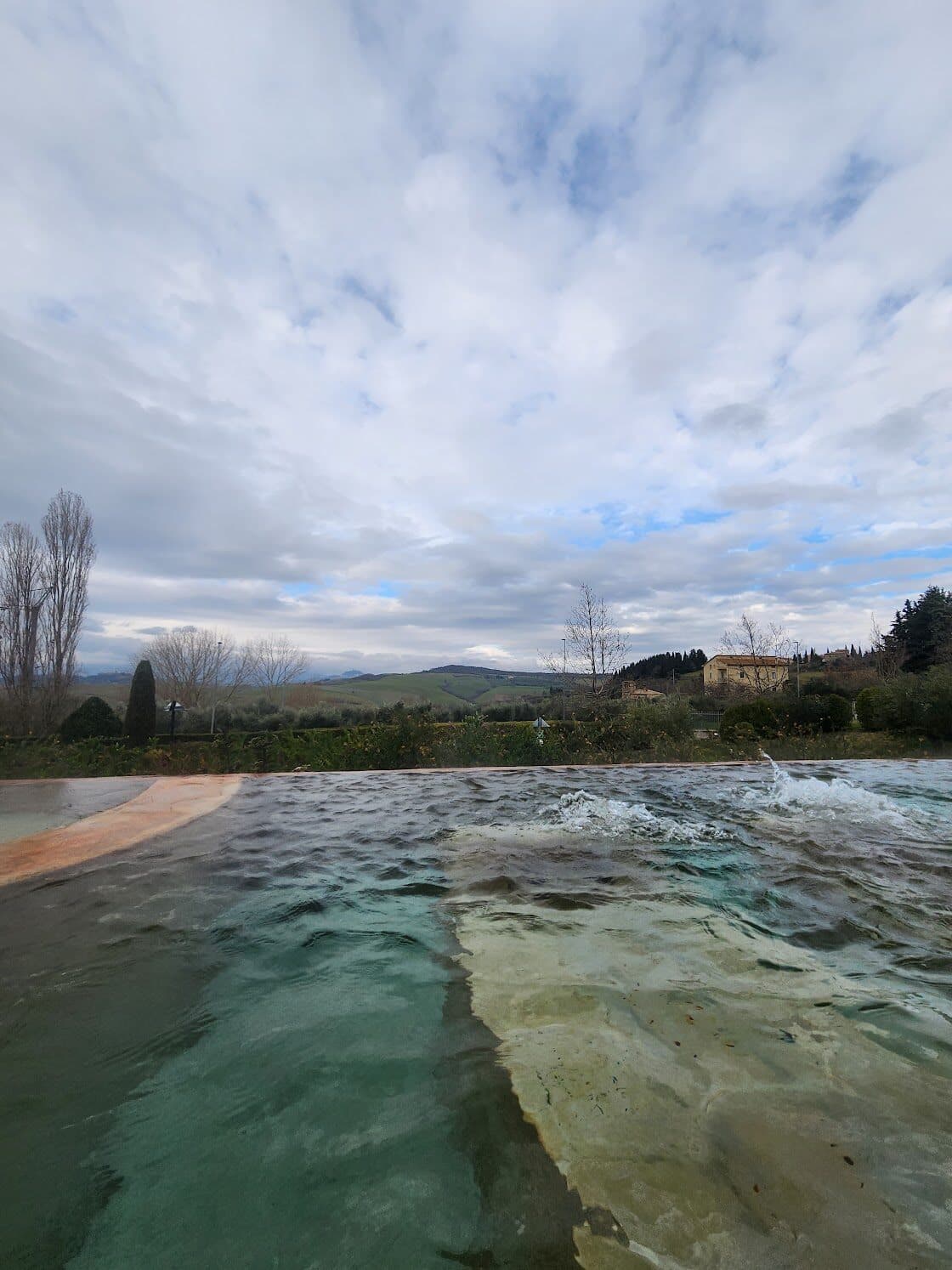 The outdoor thermal pool at Fonteverde with panoramic Tuscan views