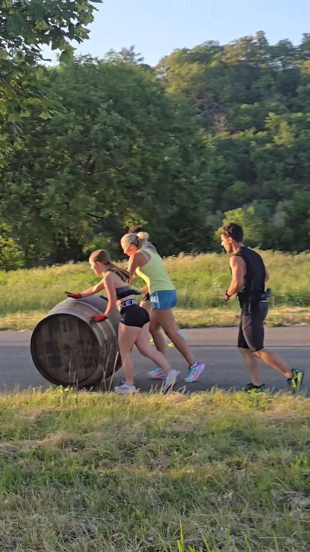 Bravio delle Botti barrel practice on a country road near Montepulciano