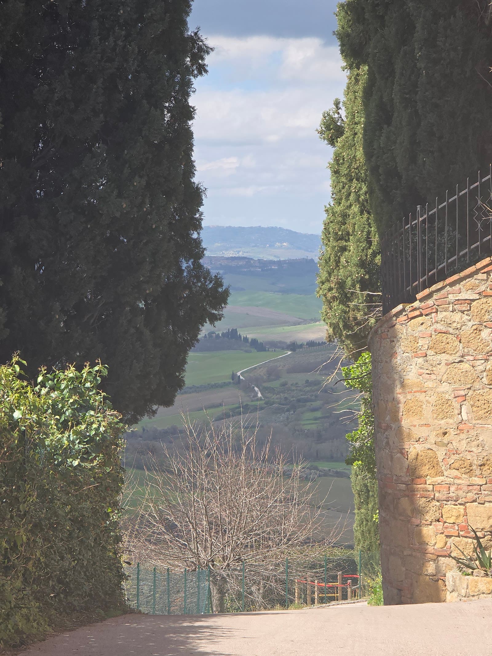 The Val d'Orcia side is the scenery-first choice: beautiful for drives, Pienza, Monticchiello, and slow landscape days, but less convenient for casual Montepulciano dinners.