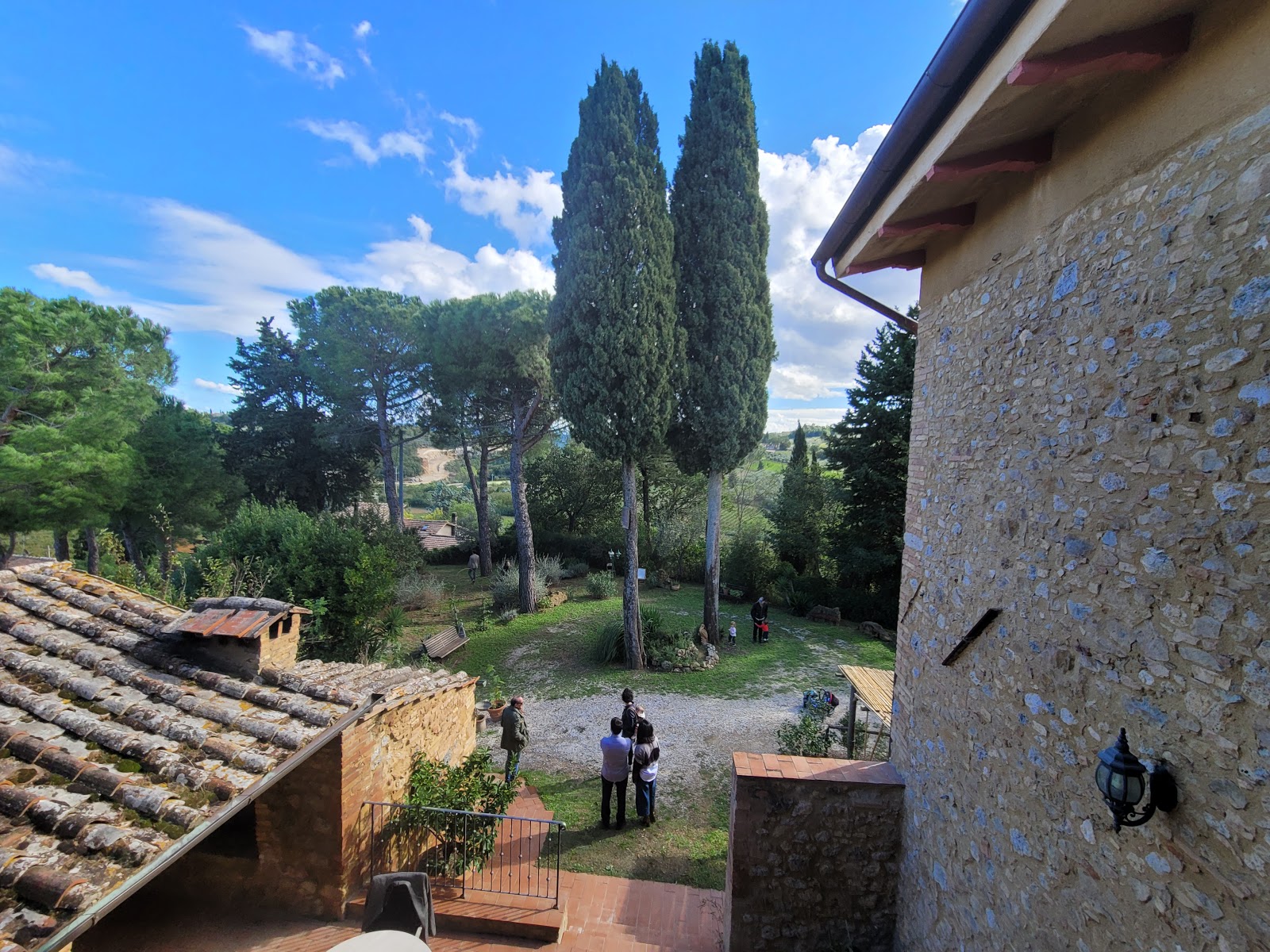 A good Montepulciano villa is not only the pool: look for shade, mature cypress trees and outdoor space where the group can actually spend the day.